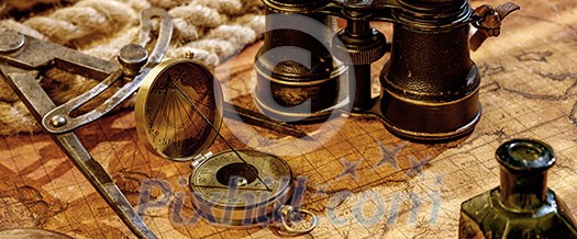 Old vintage retro compass and binoculars on ancient world map. Vintage still life. Travel geography navigation concept background.