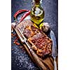 Meat Ribeye steak entrecote close-up on cutting board