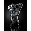 Bodybuilder with a beard lifts a heavy kettlebell. Black and white portrait of a strongman.