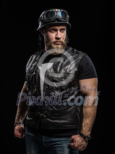 Portrait Handsome Bearded Biker Man in Leather Jacket and Helmet over Black Background Portrait Handsome Bearded Biker Man in Leather Jacket and Helmet over Black Background