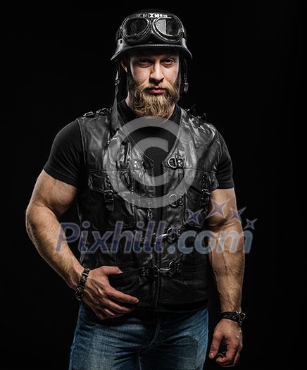 Portrait Handsome Bearded Biker Man in Leather Jacket and Helmet over Black Background