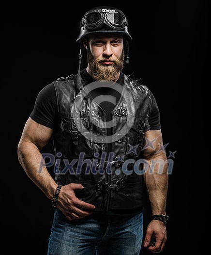 Portrait Handsome Bearded Biker Man in Leather Jacket and Helmet over Black Background Portrait Handsome Bearded Biker Man in Leather Jacket and Helmet over Black Background