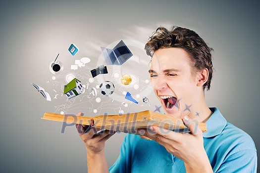 Young man in casual holding opened book with icons flying out Young man in casual holding opened book with icons flying out