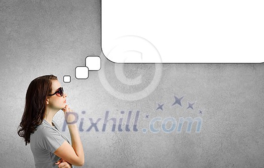 Young woman in casual with blank speech bubble above Young woman in casual with blank speech bubble above