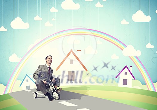 Young handsome businessman riding three wheeled bicycle Young handsome businessman riding three wheeled bicycle