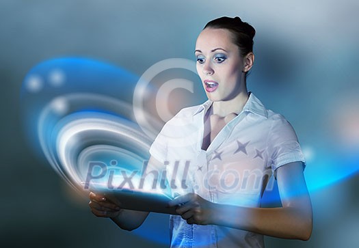 Young pretty surprised woman using tablet pc Young pretty surprised woman using tablet pc