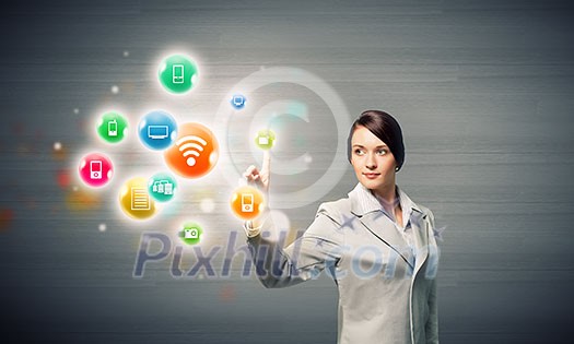 Young attractive businesswoman touching media colorful icon Young attractive businesswoman touching media colorful icon