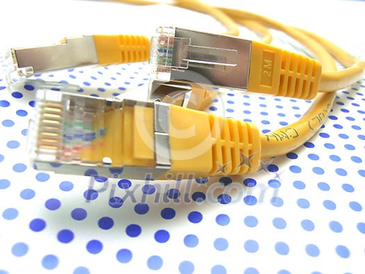 yellow ethernet cable on dotted background yellow ethernet cable on dotted background
