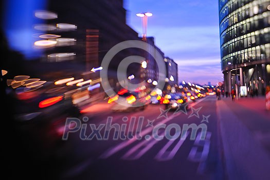 busy traffic scene of street in night with car traffic and vivid colored city scene busy traffic scene of street in night with car traffic and vivid colored city scene