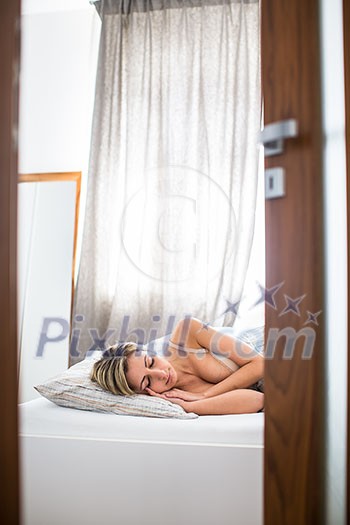 Beautiful young woman sleeping in bed Beautiful young woman sleeping in bed