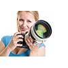 Pretty, female photographer with digital camera - DSLR and a huge telephoto lens (color toned image; shallow DO