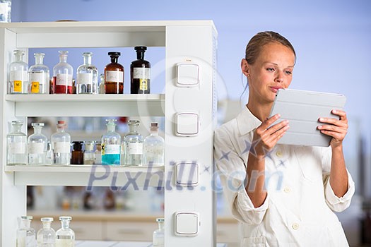 Portrait of a female researcher doing research in a lab (shallow DOF; color toned image) Portrait of a female researcher doing research in a lab (shallow DOF; color toned image)