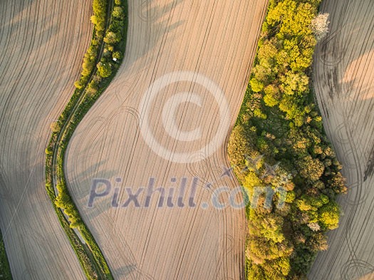 Farmland from above - aerial image of a lush green filed Farmland from above - aerial image of a lush green filed