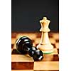 Closeup of checkmate on king by queen winning in chess game