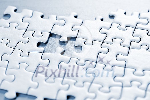 Jigsaw puzzle assembled with a piece missing Jigsaw puzzle assembled with a piece missing
