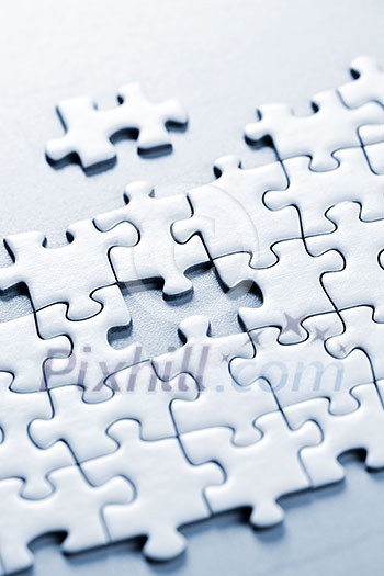 Jigsaw puzzle assembled with a piece missing Jigsaw puzzle assembled with a piece missing