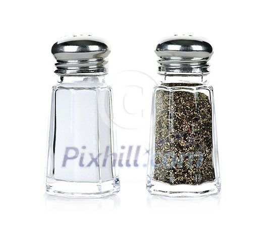Glass salt and pepper shakers isolated on white background Glass salt and pepper shakers isolated on white background