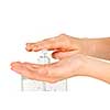 Female hands using hand sanitizer gel pump dispenser