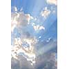 Background of blue sky with sun rays and clouds