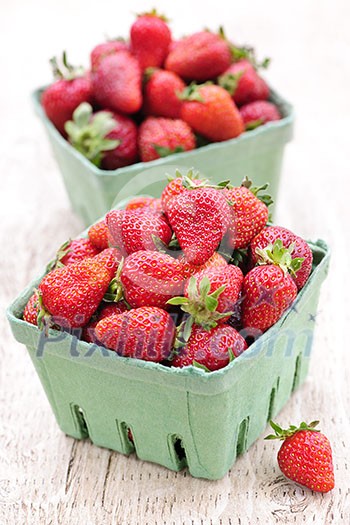 Two containers of fresh organic red strawberries