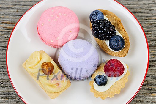 Dessert plate with french macarons and pastries Dessert plate with french macarons and pastries