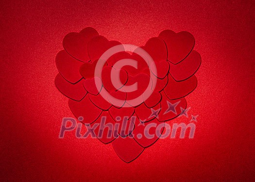 Romantic heart made of many smaller red paper hearts for valentines day