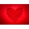 Romantic heart made of many smaller red paper hearts for valentines day