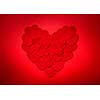 Romantic heart made of many smaller red paper hearts for valentines day