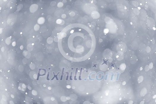 Background of snow flurry falling in winter with some motion blur
