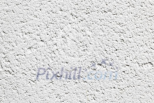 Background detail of white textured concrete wall surface