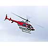 Red rescue helicopter flying mission in emergency