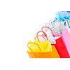 Many colorful shopping bags on white background