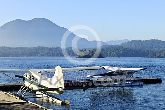 Seaplanes at dock in Tofino on Pacific coast of British Columbia, Canada Seaplanes at dock in Tofino on Pacific coast of British Columbia, Canada