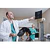 portrait of a veterinarian and assistant in a small animal clinic at work