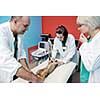 portrait of a veterinarian and assistant in a small animal clinic at work