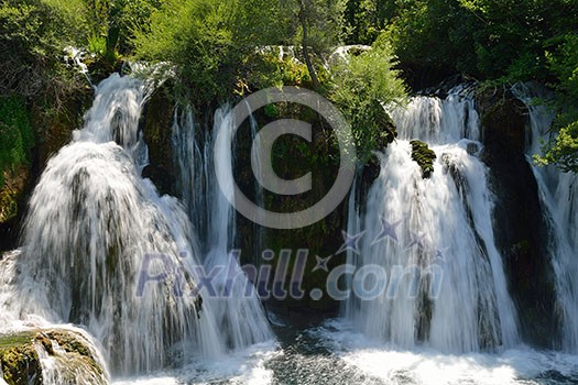 waterfall with clean and fresh water  nature with green forest in background