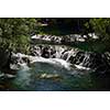 waterfall with clean and fresh water  nature with green forest in background