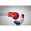 Young businesswoman in blue boxing gloves fighting big red glove on spring