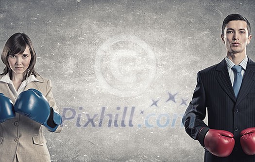 Businesswoman and businessman representing partners competition concept Businesswoman and businessman representing partners competition concept