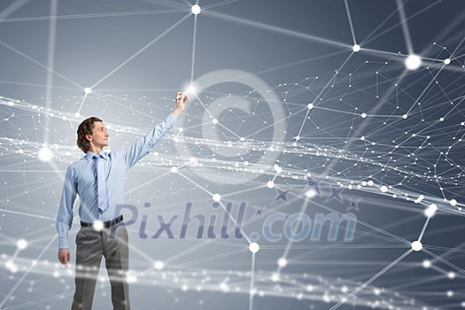 Businessman drawing connection lines with marker on screen Businessman drawing connection lines with marker on screen