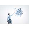 Businessman reaching hand to touch digital cube figure