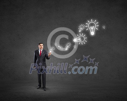 Businessman using his smartphone and glowing percent sign of screen
