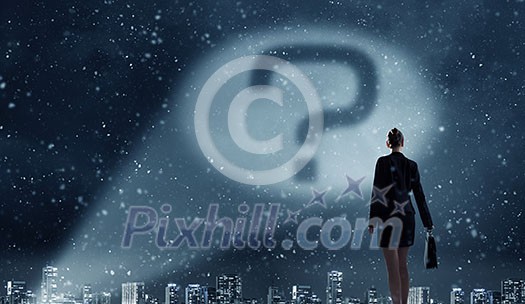 Businesswoman standing with back and looking at question mark concept Businesswoman standing with back and looking at question mark concept