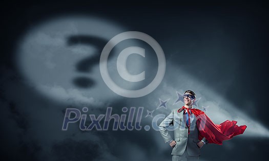 Young smiling super businessman in mask and cape at night