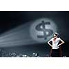 Young woman super hero and dollar sign in spotlight