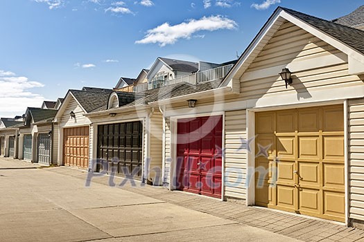 Row of garage doors at parking area for townhouses
