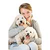 Pretty teenage girl holding two adorable coton de tulear dogs