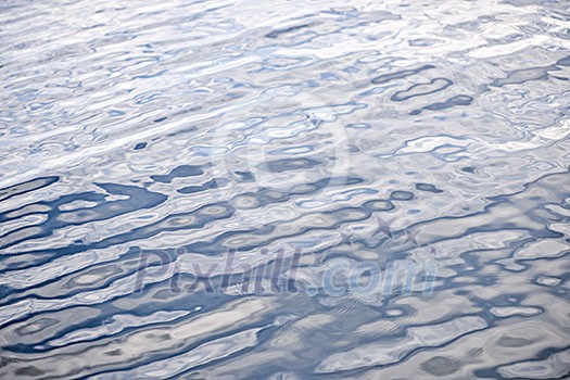 Abstract background of blue water surface with ripples Abstract background of blue water surface with ripples