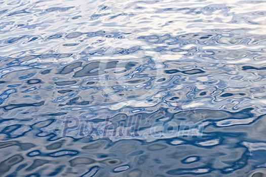 Abstract background of blue water surface with ripples