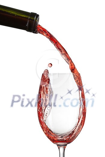 Red wine pouring into glass with splash isolated on white